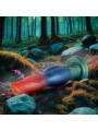 Dildo de fantasía Epic Arion tumbado sobre musgo, con base verde y cuerpo azul y coral