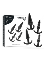 Caja Addicted Toys y 4 plugs anales negros incluidos en el set de progresión